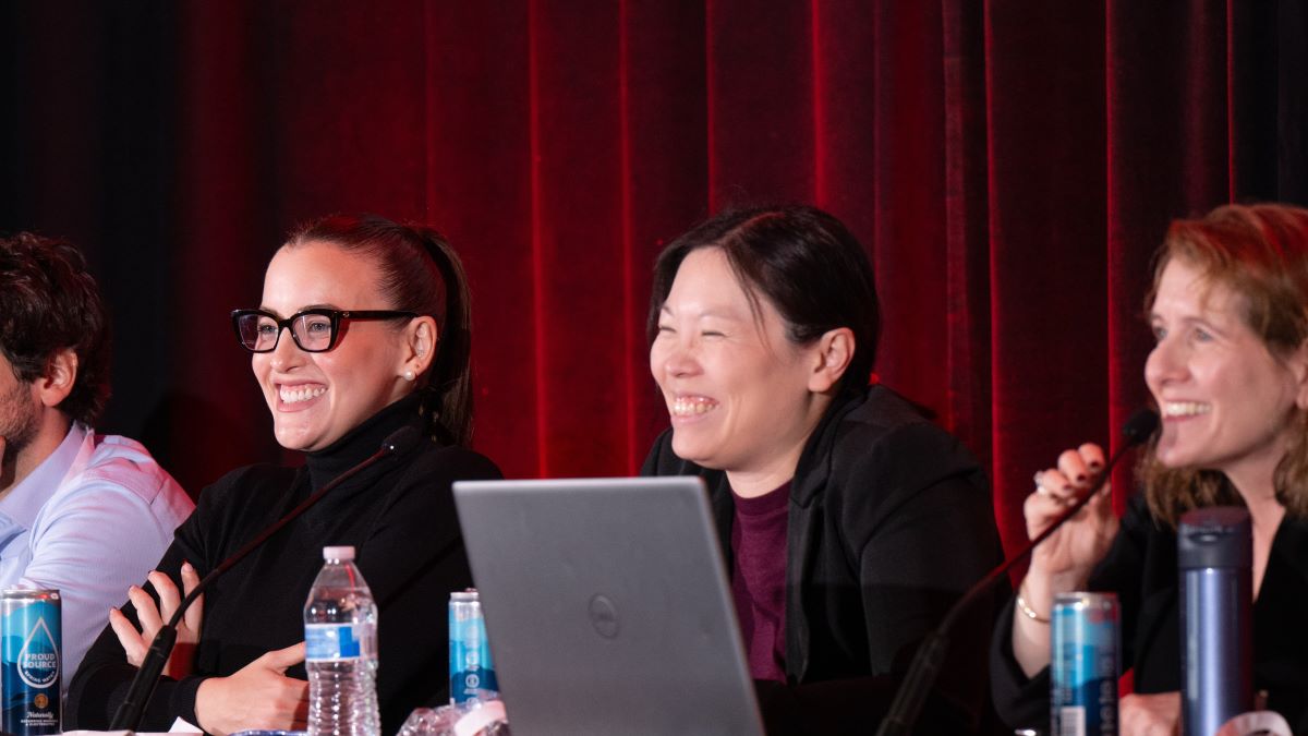 Panelists smile as the interact with attendees at an ASH-FDA joint symposium