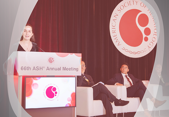 A woman gives a lecture at the ASH annual meeting