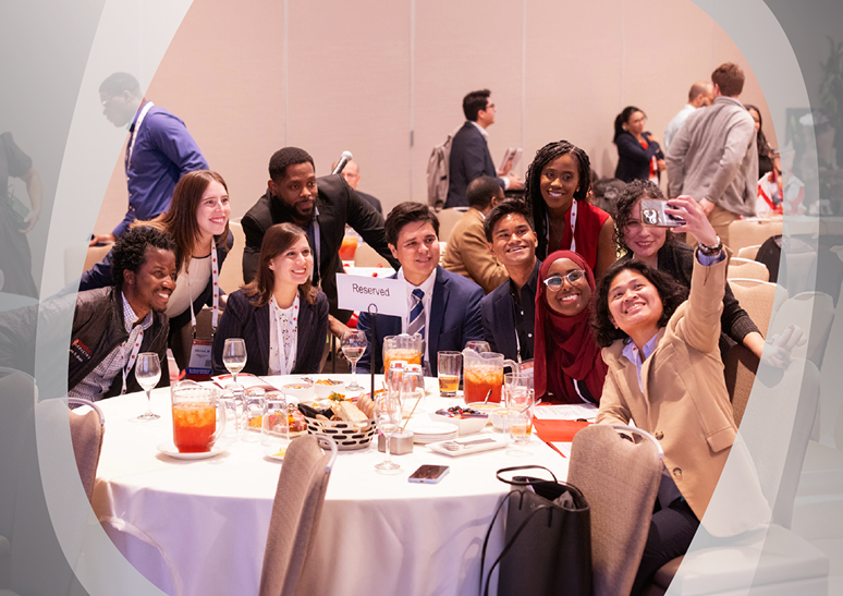 A group of HIP awardees pose for a photo at a reception