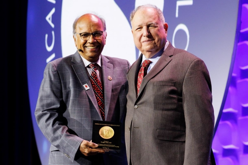 Dr.  Douglas Cines receives the Henry M. Stratton Medal from ASH President Dr. Mohandas Narla