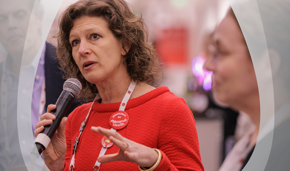 A woman in focus with other giving speech  with bold hematologists for maternal health