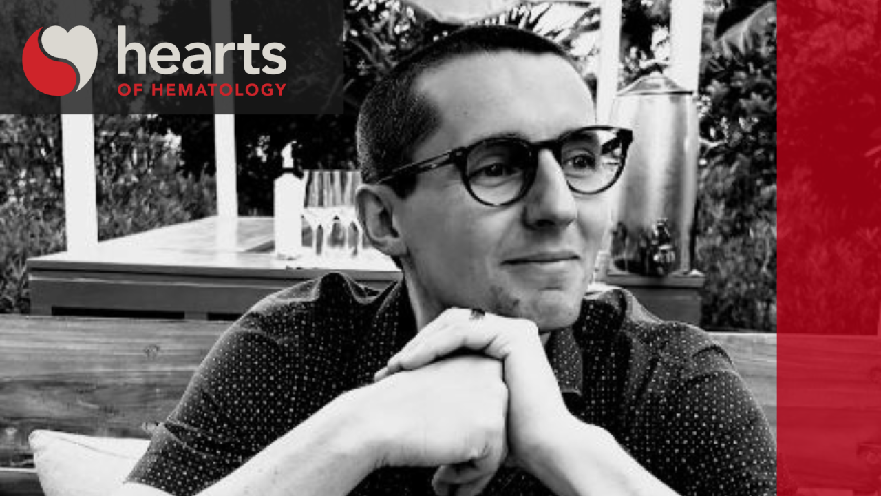 A photo of Kyle Davis with the hearts of hematology logo and branding