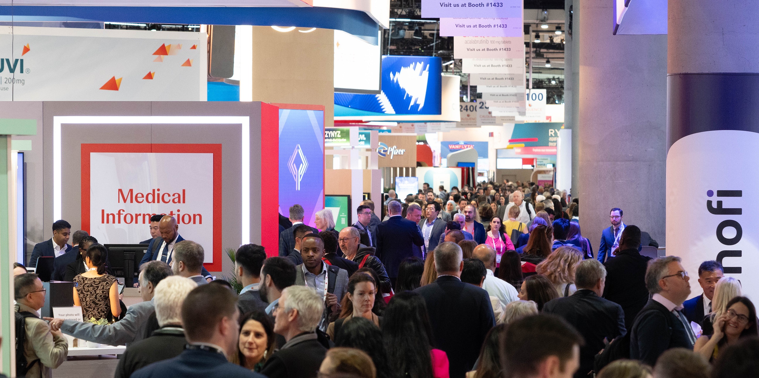 Attendees visit exhibits across the exhibit hall.