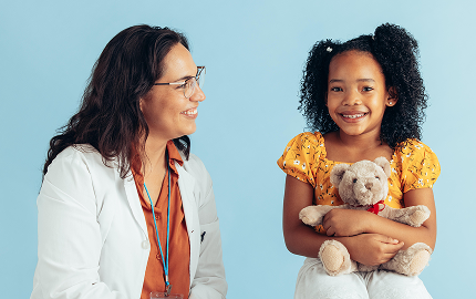 A photo of a doctor attending to a young girl