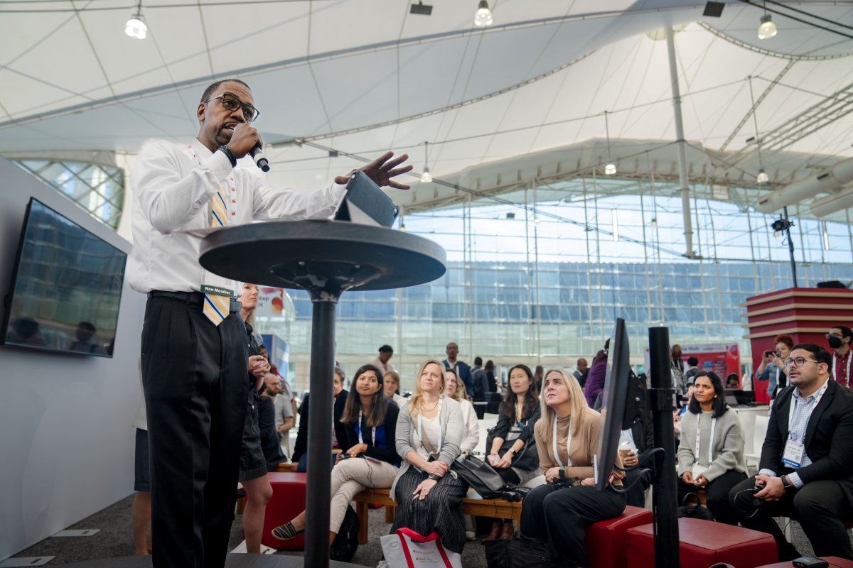 A man gives a presentation at a studio session during the ASH annual meeting